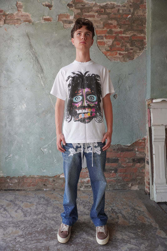 Pushin Flowers rhinestone patch denim jeans – PF statement streetwear, model wearing, full-length
