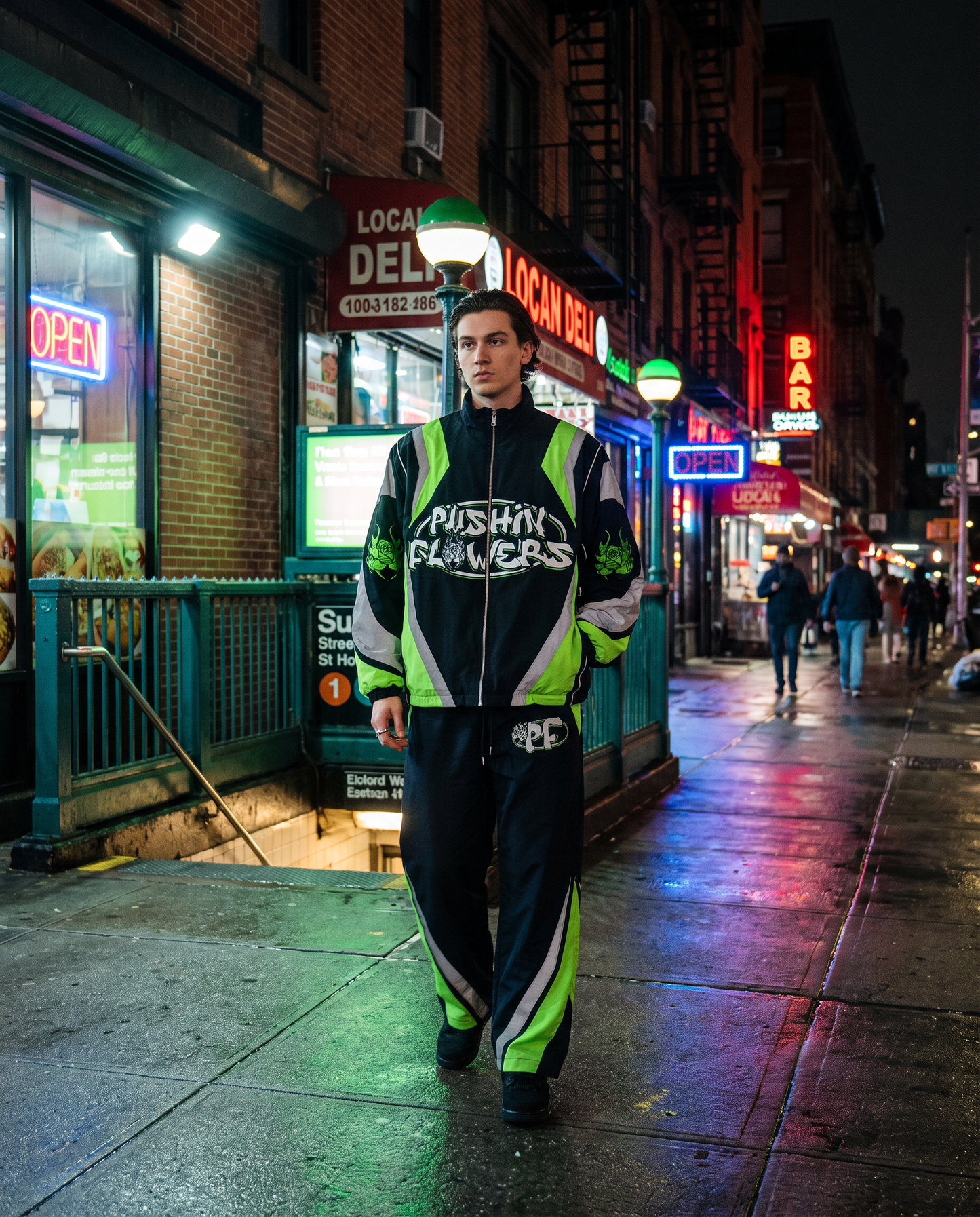 Model wearing Pushin Flowers Two-Piece Track Suit on a NYC street at night