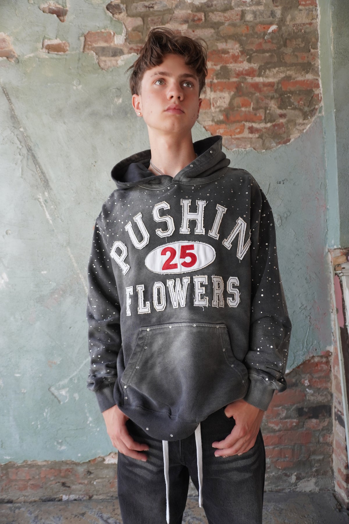 Pushin Flowers rhinestone patch hoodie – premium streetwear pullover, angled drop-shoulder fit