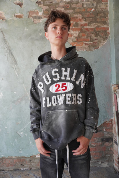 Pushin Flowers rhinestone patch hoodie – premium streetwear pullover, angled drop-shoulder fit