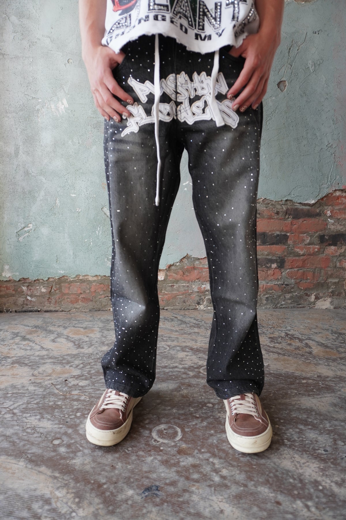 Pushin Flowers rhinestone patch denim jeans – PF statement streetwear, studio flat-lay