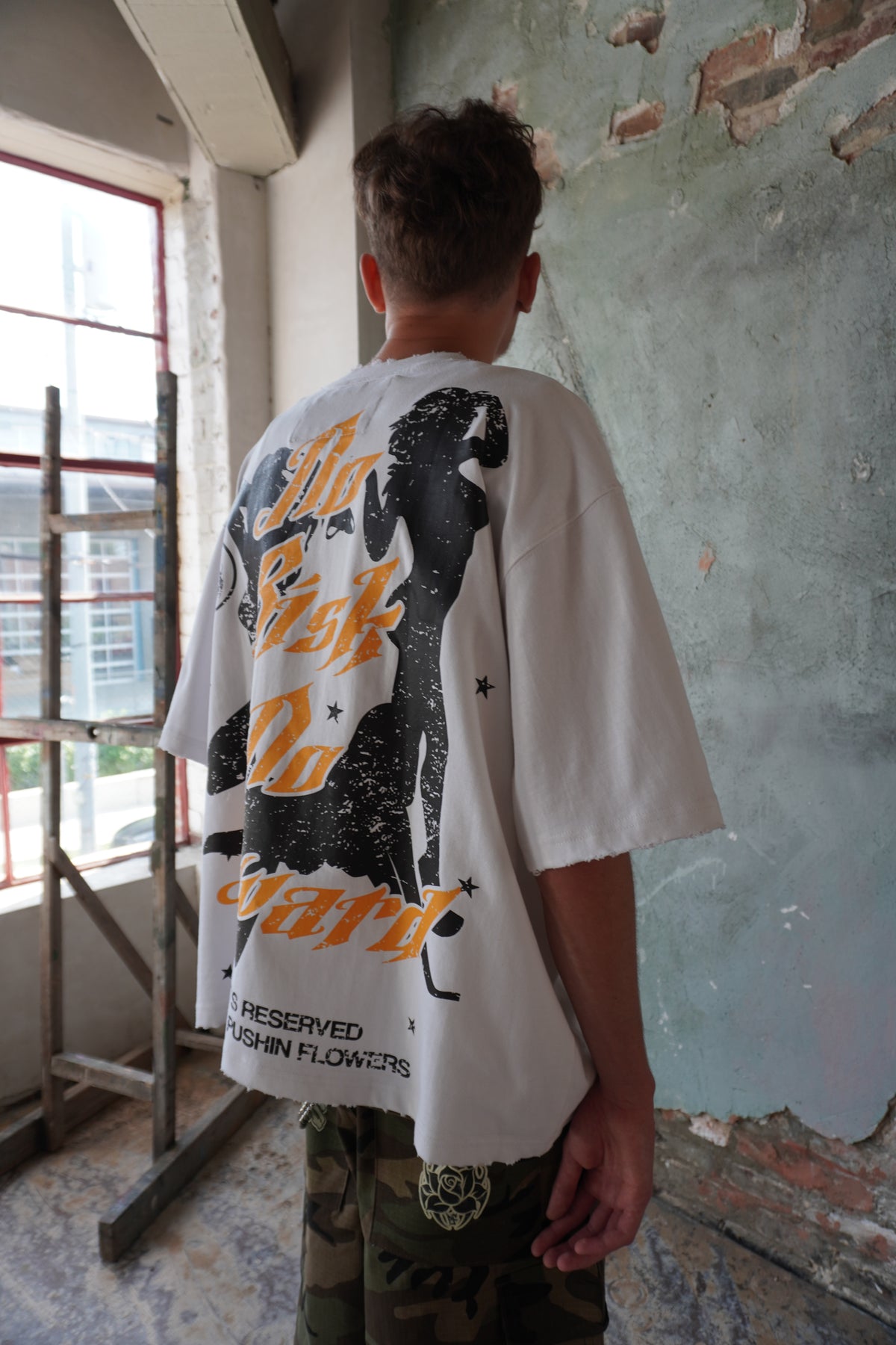 Pushin Flowers Memphis graphic tee – PF City Series streetwear, street styling shot