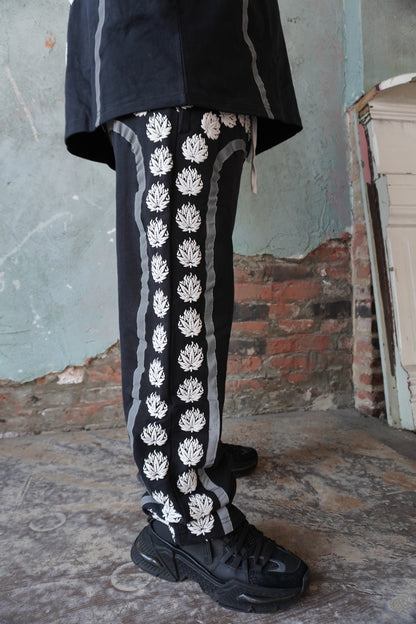Pushin Flowers leaf print baggy pants – PF botanical streetwear, front view