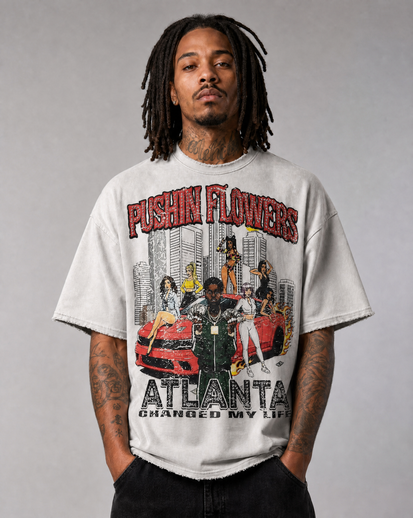 Model wearing Pushin Flowers Atlanta graphic t-shirt, studio streetwear photo