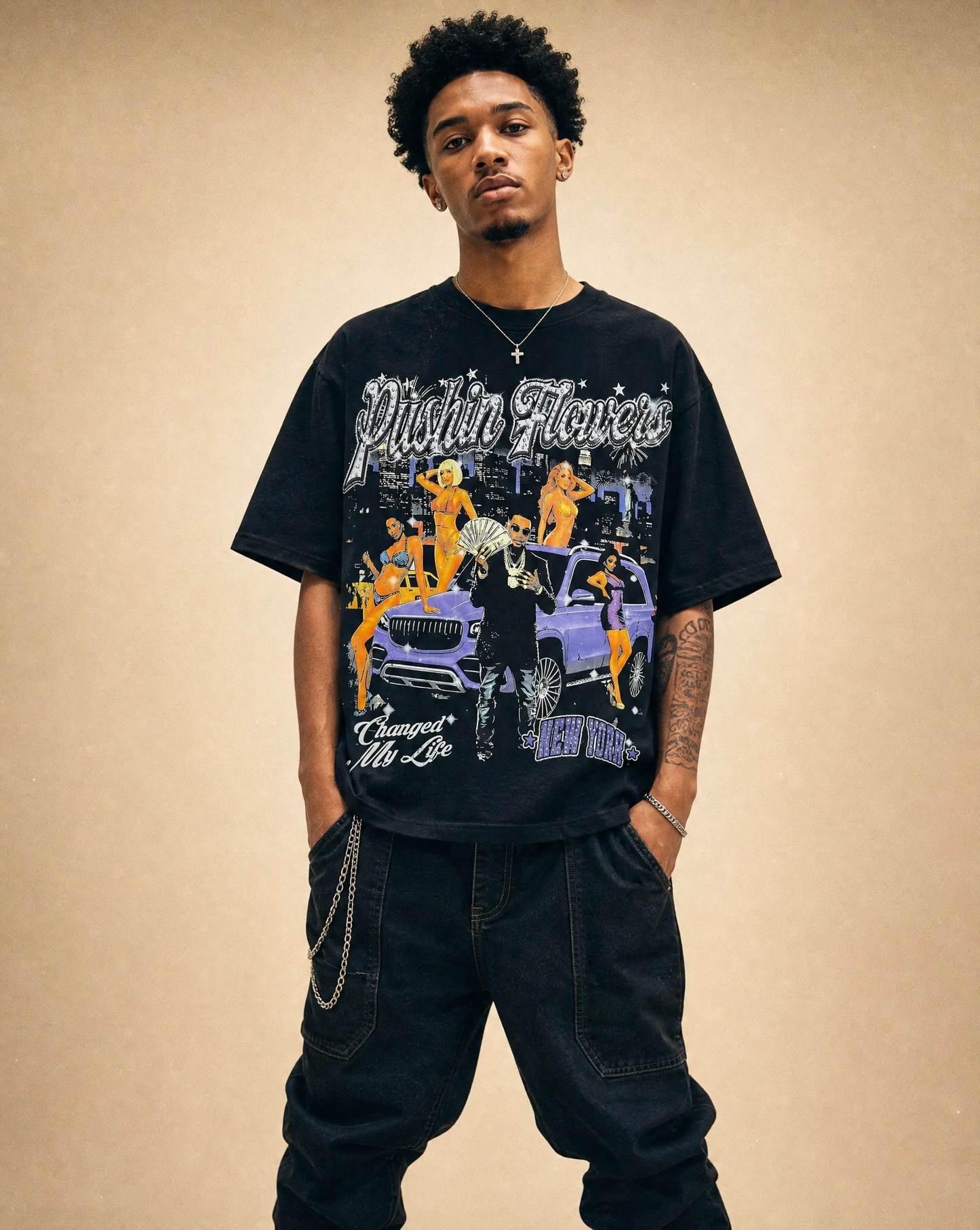 Model wearing Pushin Flowers New York graphic t-shirt, studio streetwear photo