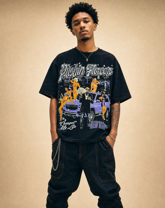 Model wearing Pushin Flowers New York graphic t-shirt, studio streetwear photo