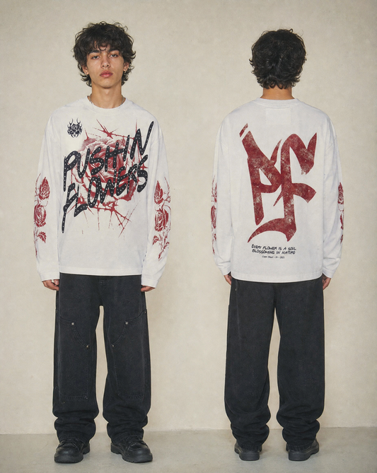 Model wearing Pushin Flowers Rose graphic long sleeve shirt, alternate studio angle