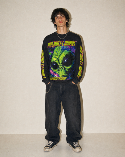 Model wearing Pushin Flowers Spacetour graphic long sleeve shirt, studio streetwear photo