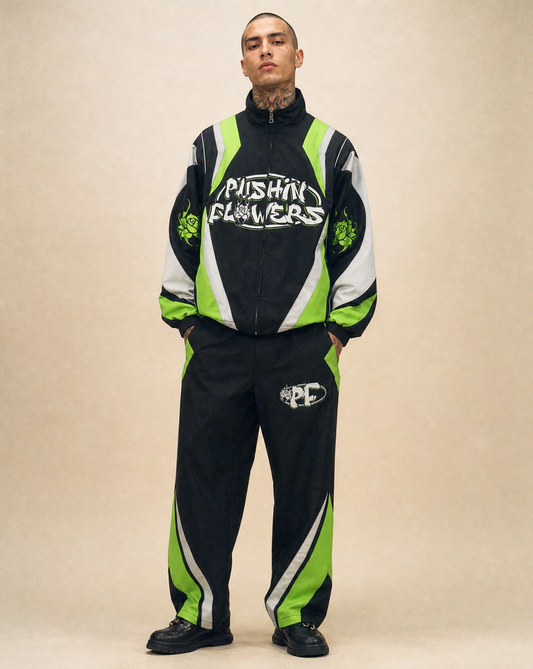Model wearing Pushin Flowers Two-Piece Track Suit, studio streetwear photo