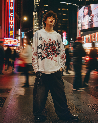 Model wearing Pushin Flowers Rose graphic long sleeve shirt, streetwear editorial